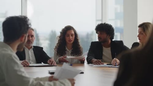 Businesspeople Collaborate in Modern Office Meeting