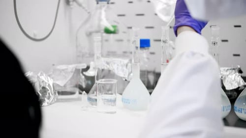 Scientist Working with Liquids in a Medical Lab