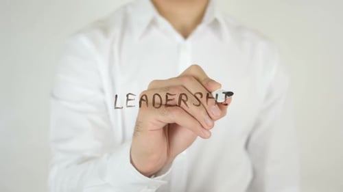 Writing the Word Leadership on Glass Surface