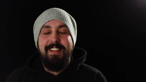Smiling Man with Beard and Beanie, Close-Up Portrait