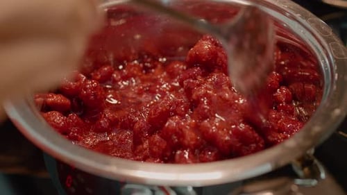 Close up of Raspberry Jam Cooking in Pot