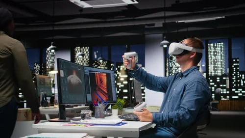 Male Game Developer Using VR Glasses and AI Tech to Design a Spaceship