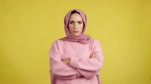 Muslim Woman Crossing the Arms with an Angry Expression