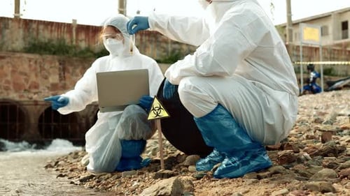 Ecologists sample water contaminated with dangerous, waterhazard toxins into tubes