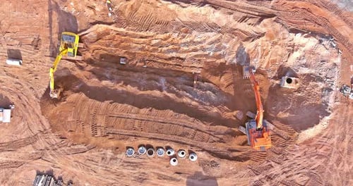 Construction Site with Heavy Machinery Aerial View