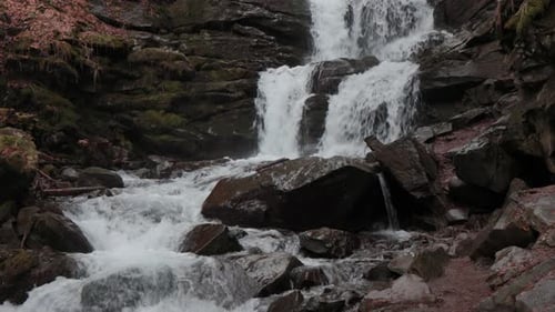 The water flows beautifully over the rocks. Mountain river. Beautiful little waterfalls.