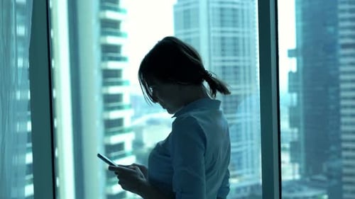 Young Businesswoman Browsing on Smartphone