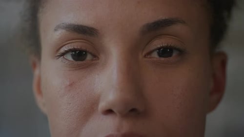 Woman Eyes Open in Slow Motion Extreme Close Up