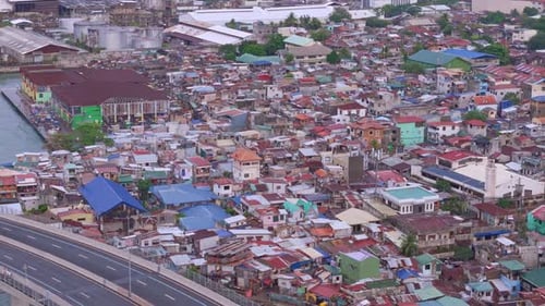 Overhead panning view of the poverty stricken squalid slums of Cebu City's downtown area.