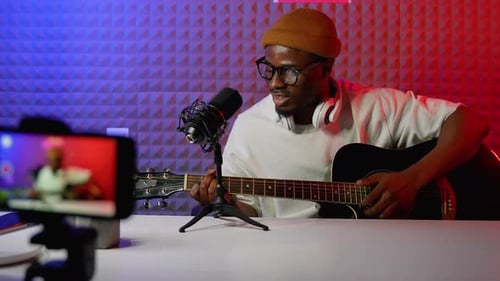 Guitarist Plays Acoustic Guitar with Microphone Setup