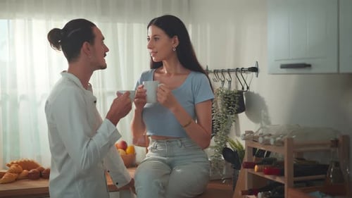 Couple Drinking Coffee Together in Modern Kitchen