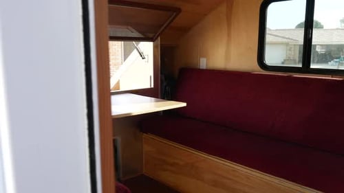 Inside Small Trailer with Benches and Window