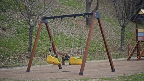 Lonely Swing Swaying in a empty park.