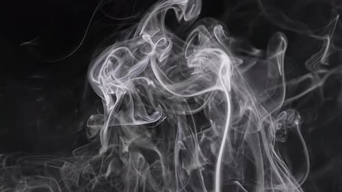 Ethereal Wisps of Smoke Against a Dark Background