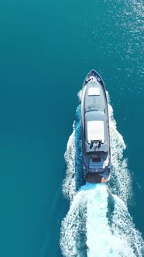 Aerial Shot of Yacht Sailing on Blue Sea