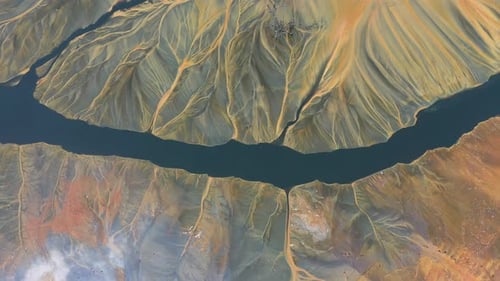 Flying over contaminated mine waters in decanting pond aerial view. Environmental pollution