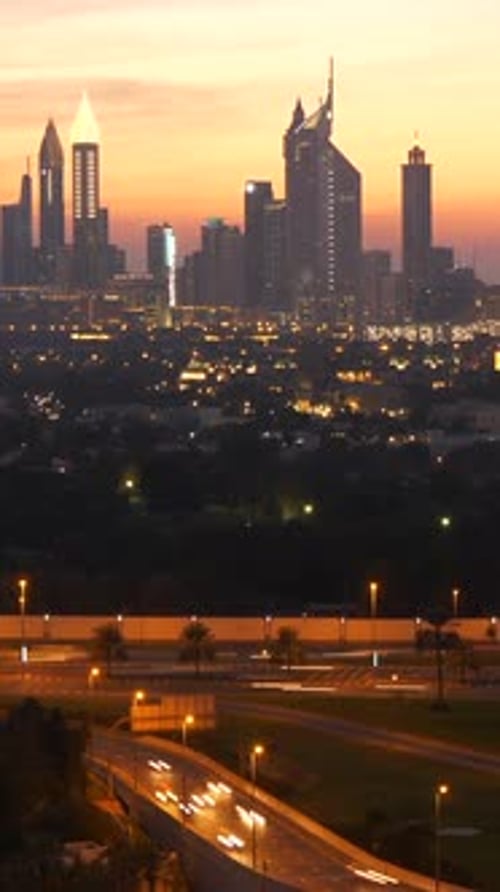 Witness the Breathtaking Beauty of a Stunning Sunset Casting Shadows Over a Modern City Skyline