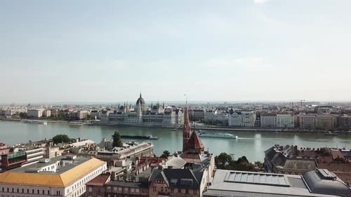 Stunning drone shot of the Danube in Hungary and the palace of parliament viewed from a distance. Dr