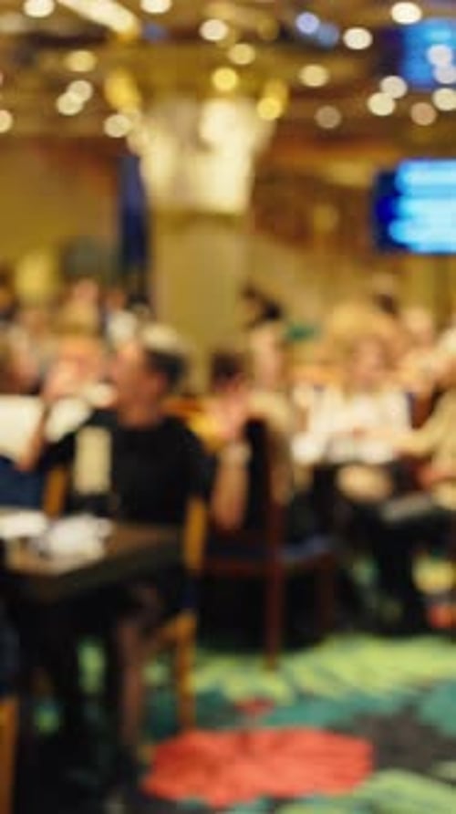 Defocused and Blurry Background Footage Illustrating a Busy and Lively Restaurant Scene Filled with