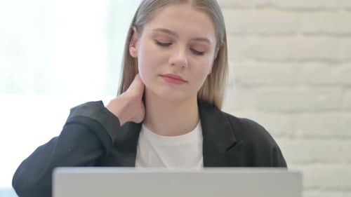 Close Up of Businesswoman having Neck Pain at Work