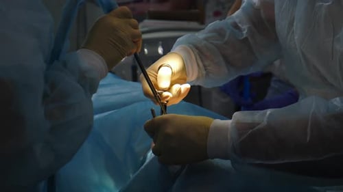 Dentist Surgeon Using Dental Syringe to Make Anesthesia During Patient Treatment