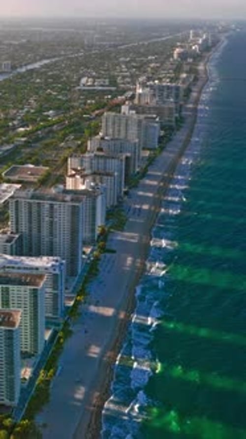 Aerial view of Miami coastline with vibrant beaches and tall buildings
