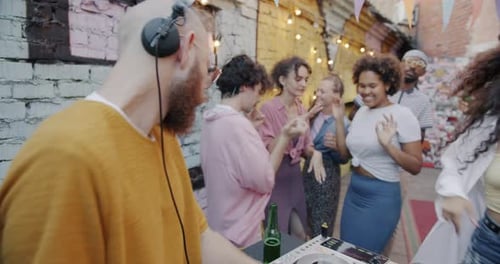 Young Adults Dancing at an Outdoor Party