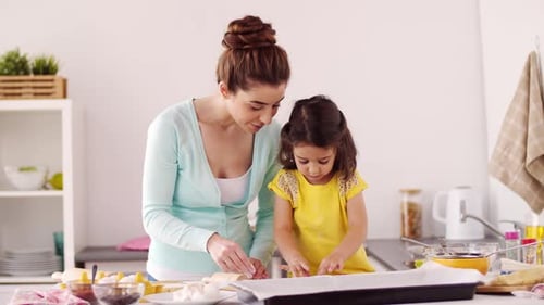Family, Cooking and People Concept - Happy Mother and Little Daughter With