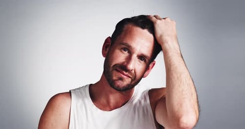 Happy man, face and hair with comb in studio for grooming, hygiene or treatment on a white