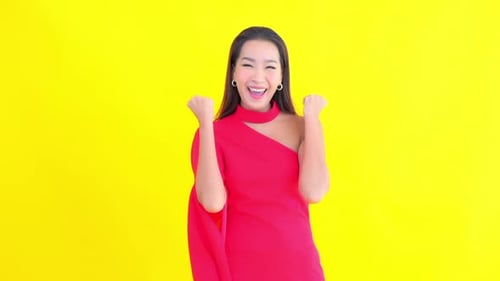 Woman Posing and Smiling on Yellow Background