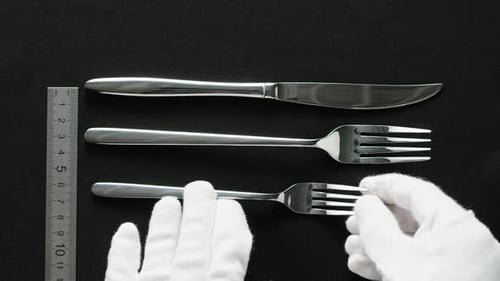 Fancy Restaurant Waiter Elegant Table Setting with White Square Plate and Silverware Arranged for