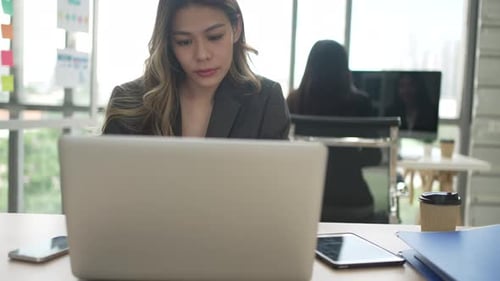 White collar workers are working with team at office.