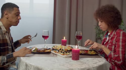 Couple Enjoying Romantic Candlelit Dinner Together