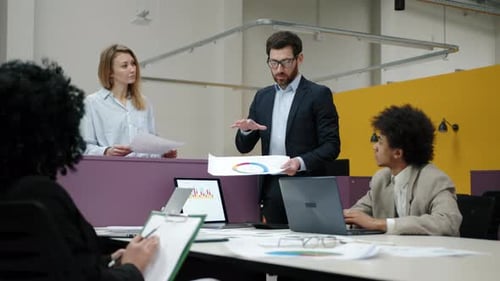 Team Discussing Data in a Modern Office