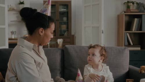 Woman and Baby Preparing for Birthday Party