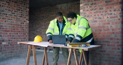 Architect, plan and men with laptop on construction site, teamwork or ideas for property