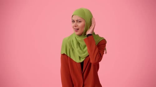 Mediumsized Isolated Video Capturing an Attractive Young Woman Wearing a Hijab Veil She Raised Her