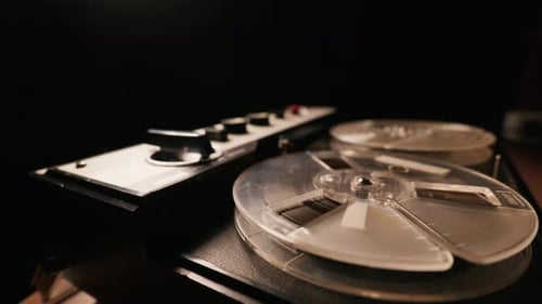 Vintage Reel to Reel Tape Recorder Playing with Cinematic Smoke