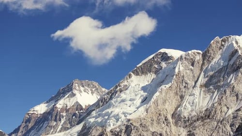 Early Morning View of SnowCapped Mountains in Nepal Featuring a HeartShaped Cloud
