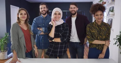 4k video footage of a diverse group of businesspeople standing together in the office during the day
