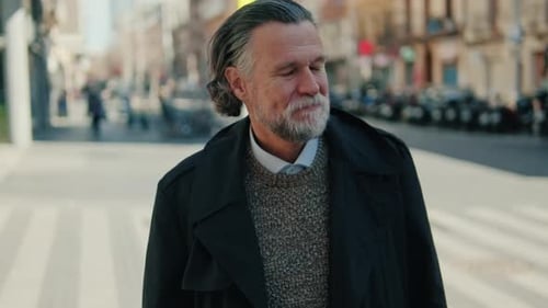 Smiling Senior Man Walks Down City Street
