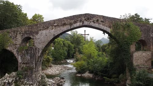 Roman bridge over river in Cangas de OnĂs, Asturias