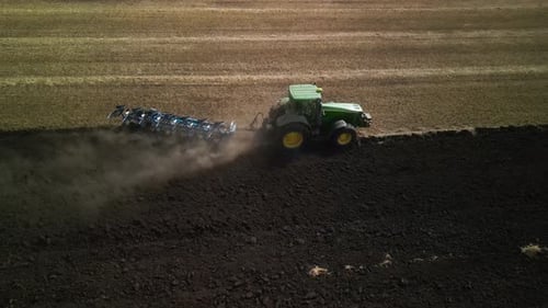 Tractors plowing the field in Ukraine