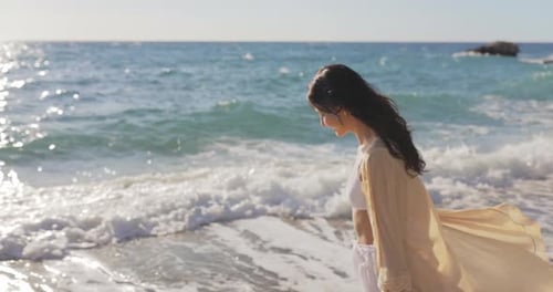 Walking Beach Woman Model on Rocky Beach During Sea Vacations