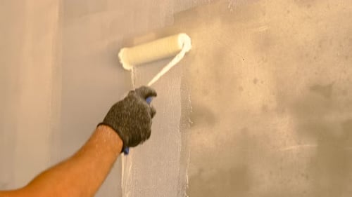 Wall Painting With Roller in Interior Setting
