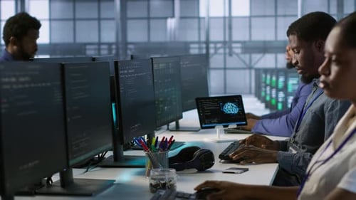 Computer Scientists in Data Center Implementing AI Systems