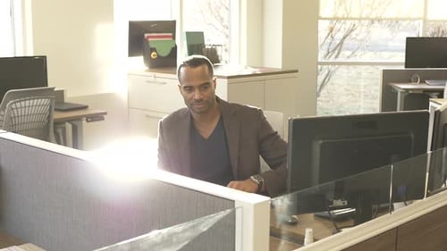 Mature Man Starting Day in Modern Office 40s