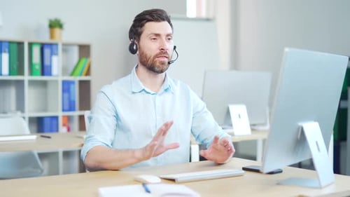 Man With Headset Talking During Video Conference