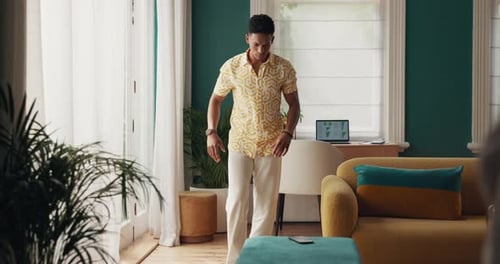 Young Man Using Smartphone in Stylish Home