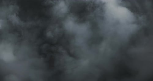 Cinematic slow motion smoke and rolling fog forming an ethereal moody atmosphere with soft vapor